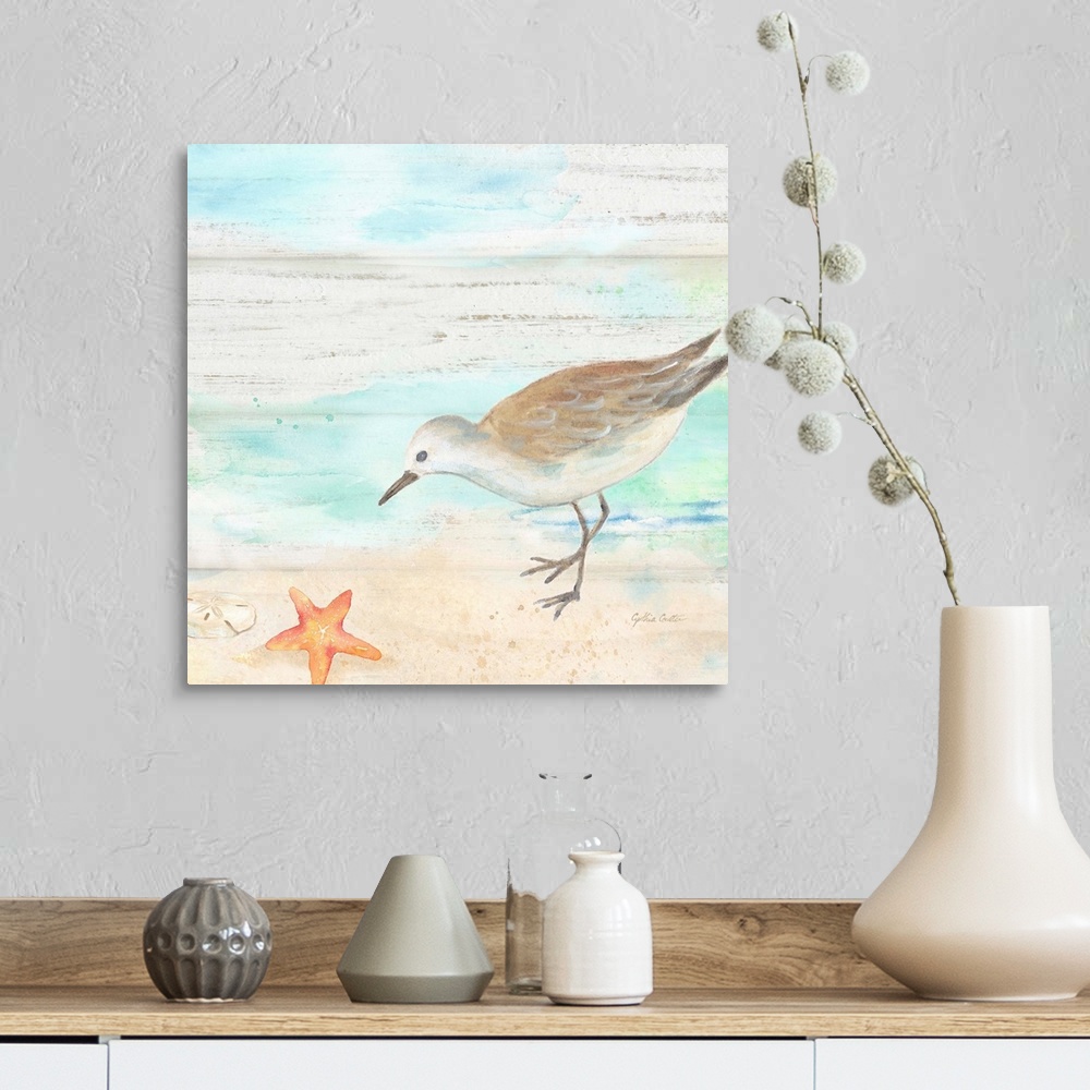 A farmhouse room featuring A charming watercolor painting of a sandpiper walking on a beach.