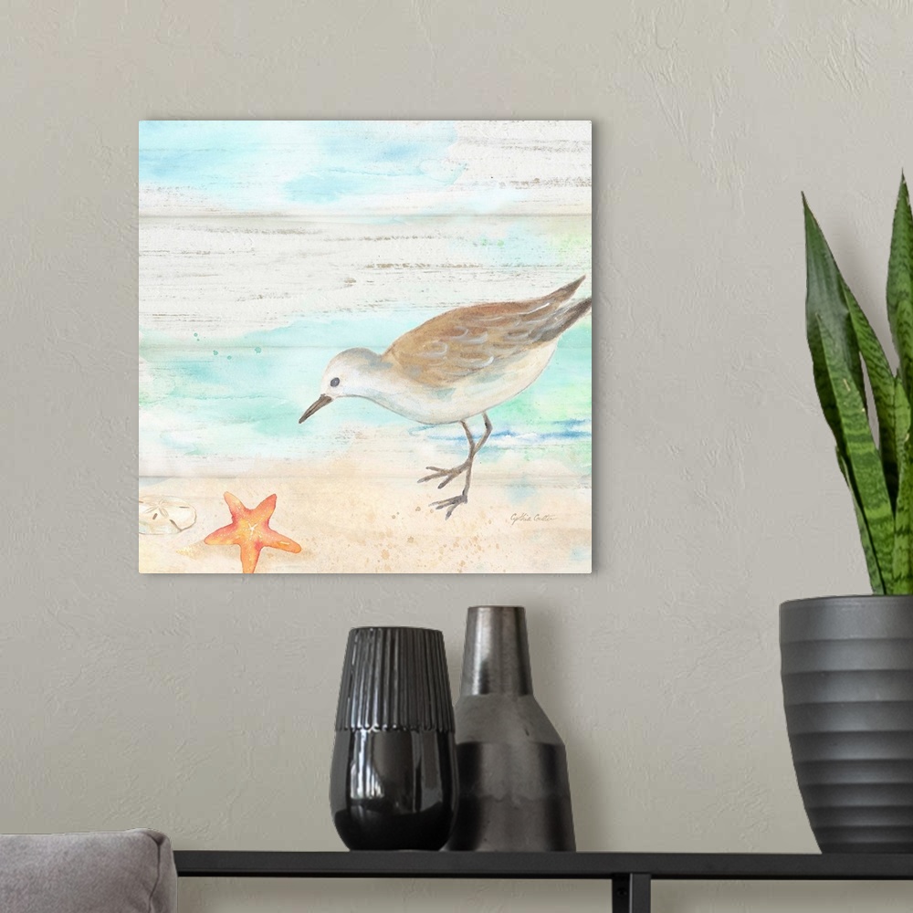 A modern room featuring A charming watercolor painting of a sandpiper walking on a beach.