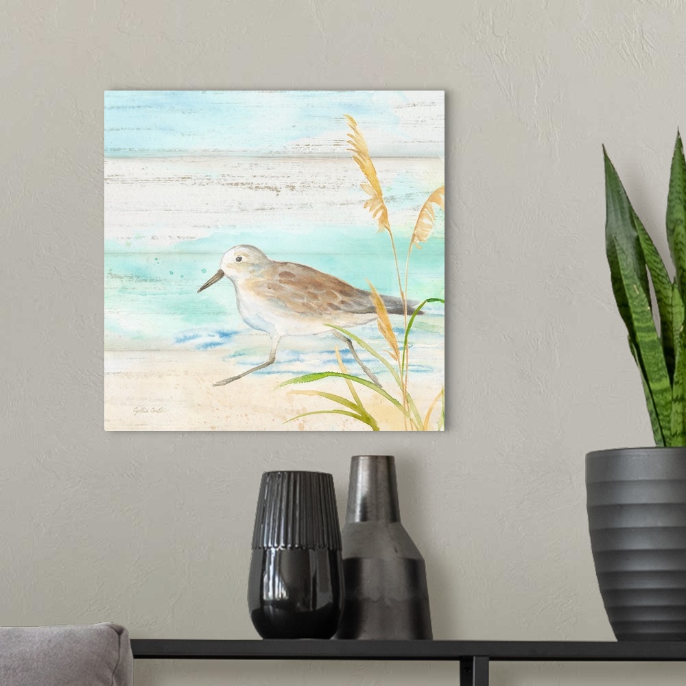 A modern room featuring A charming watercolor painting of a sandpiper walking on a beach.