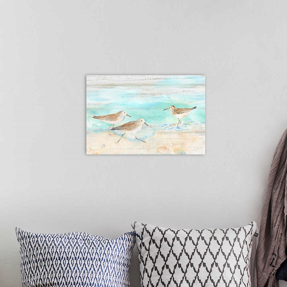 A bohemian room featuring A charming watercolor painting of sandpipers walking on a beach.