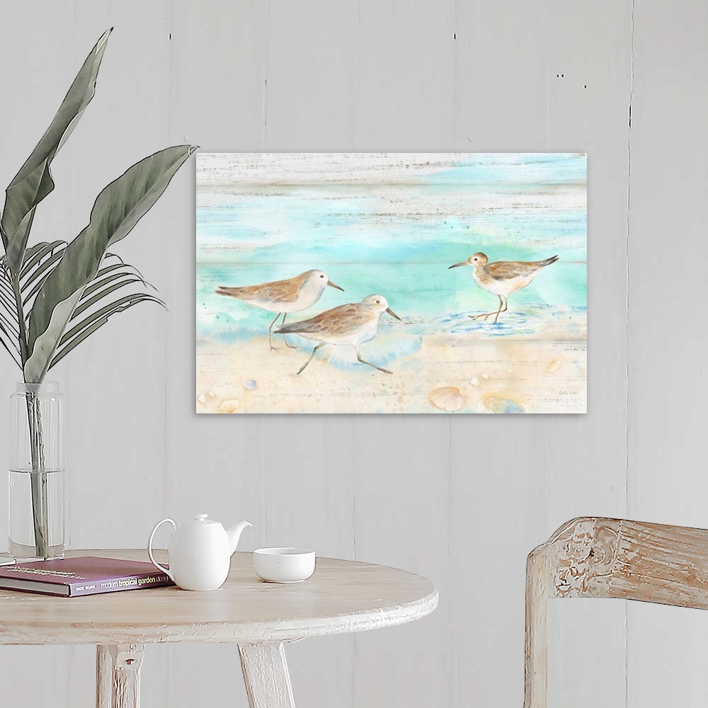 A farmhouse room featuring A charming watercolor painting of sandpipers walking on a beach.