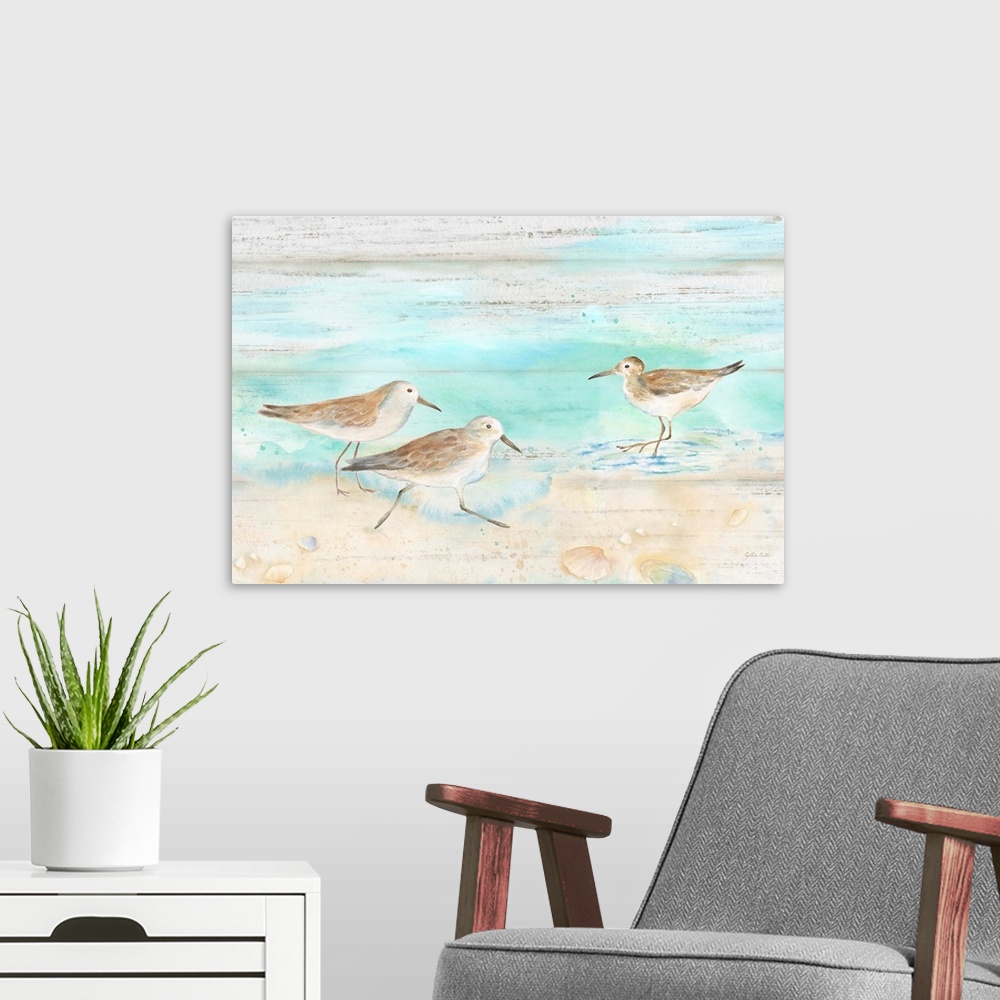 A modern room featuring A charming watercolor painting of sandpipers walking on a beach.