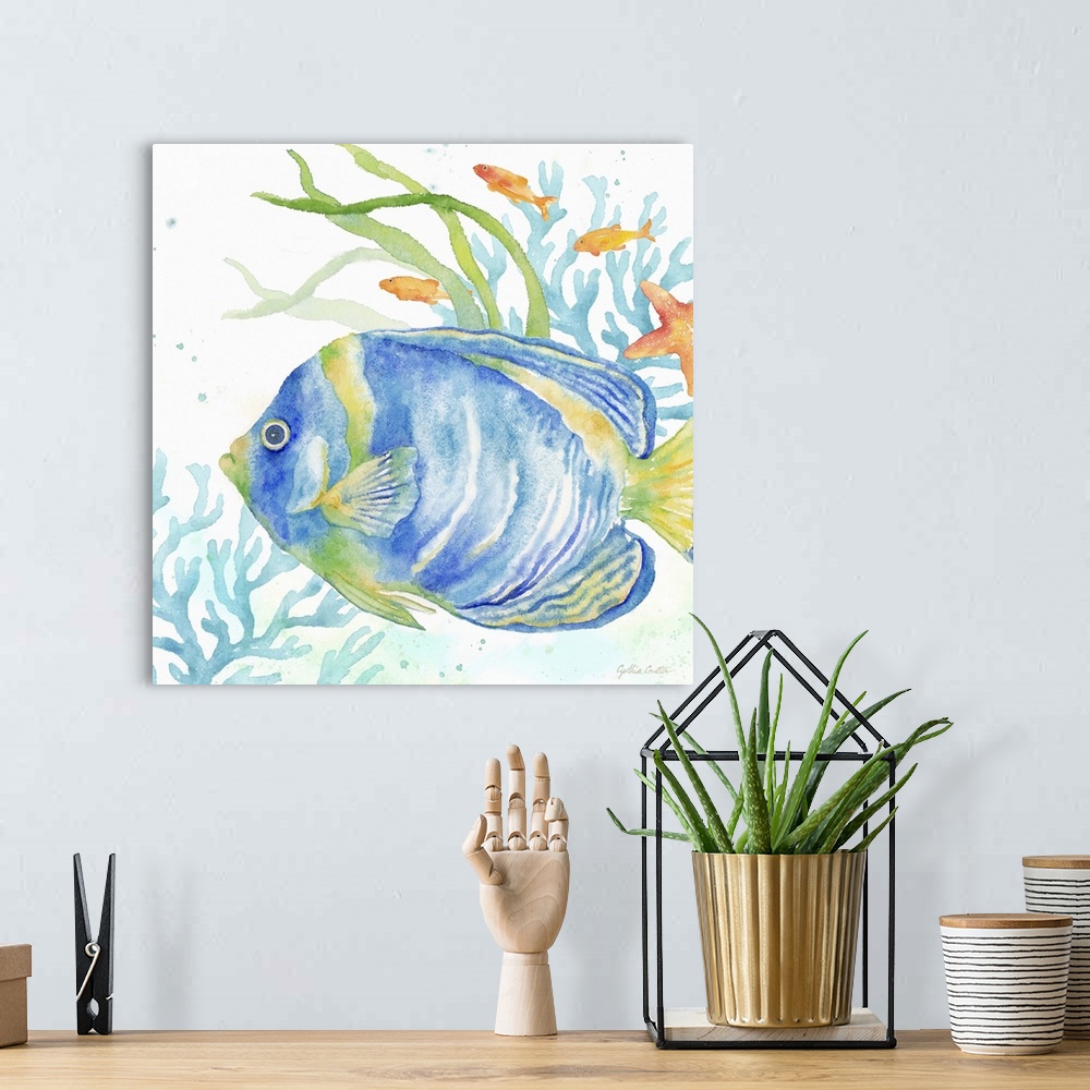 A bohemian room featuring An artistic watercolor painting of a fish and coral underwater in cool tones of blue and green.