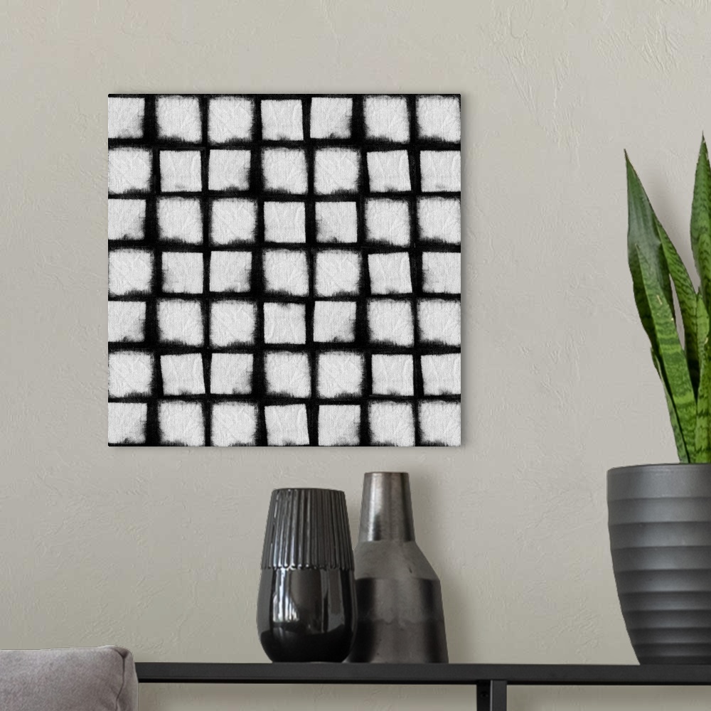 A modern room featuring Decorative design of rows of white squares on black linen.