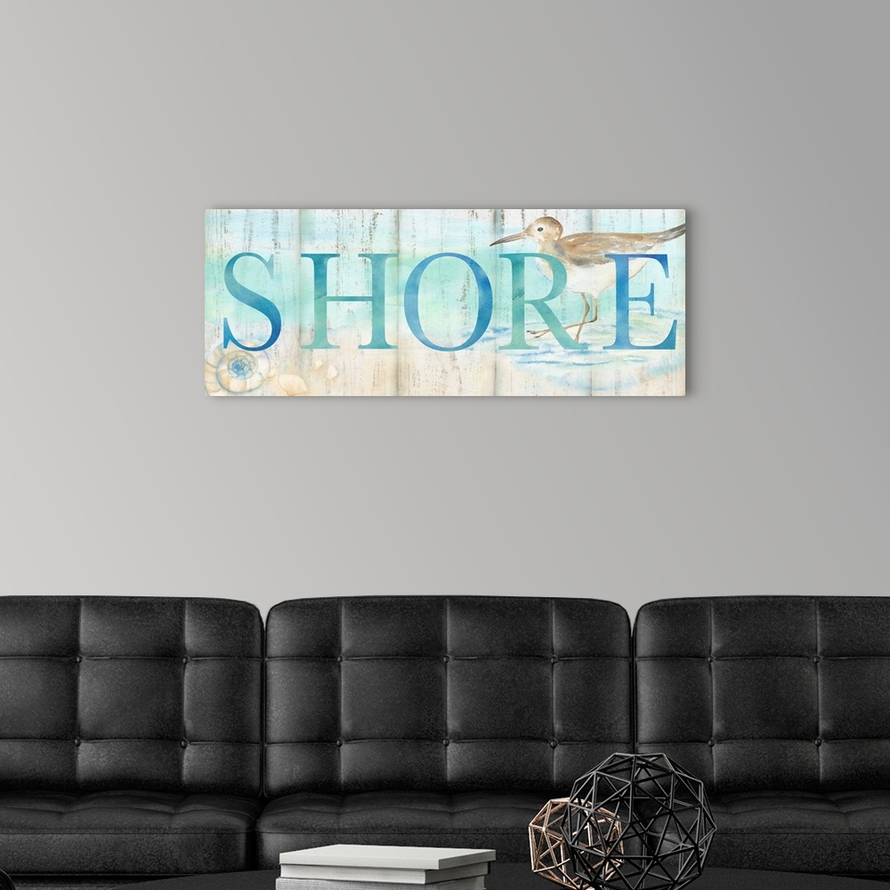 A modern room featuring "Shore" in blue over a watercolor image of a shorebird on a beach with a wood plank appearance.