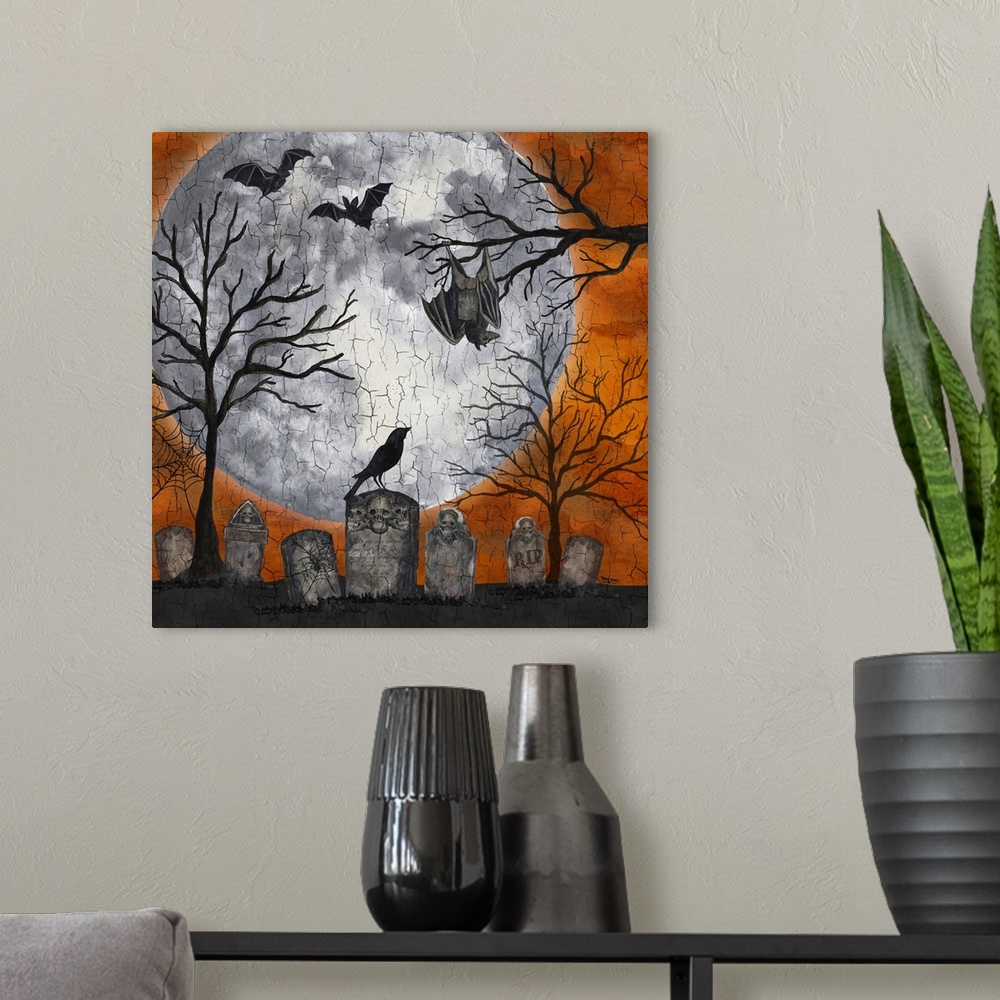 A modern room featuring A square decorative image of a graveyard scene with bats, a large moon and an orange sky.