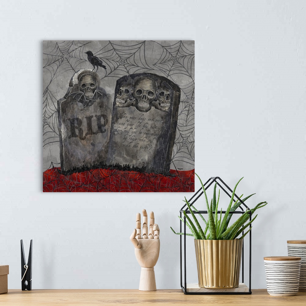 A bohemian room featuring A square decorative image of two gravestones with human skulls with a raven surrounded by webs an...