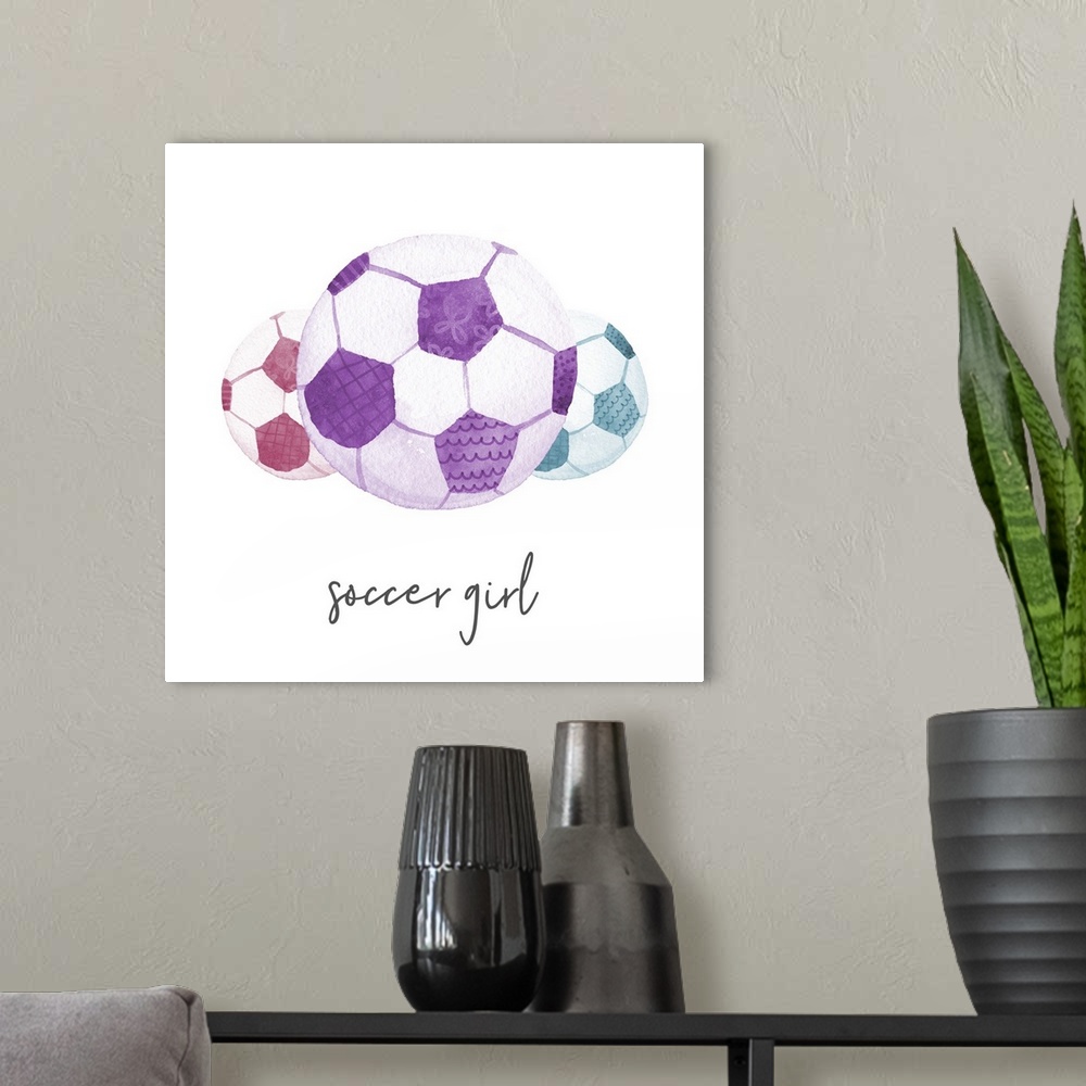 A modern room featuring A watercolor image of a group of colorful patterned soccer balls and the text 'soccer girl.'