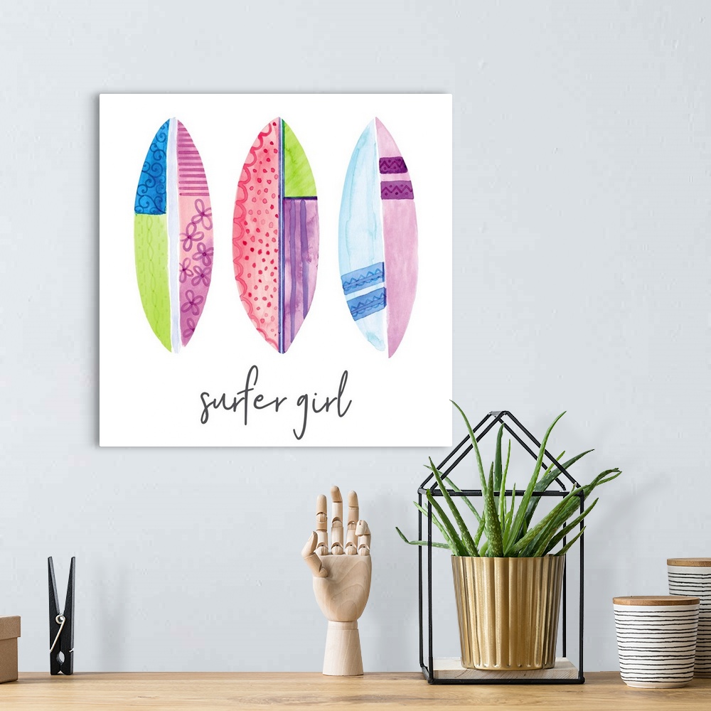 A bohemian room featuring A watercolor image of a group of colorful patterned surfboards and the text 'surfer girl.'