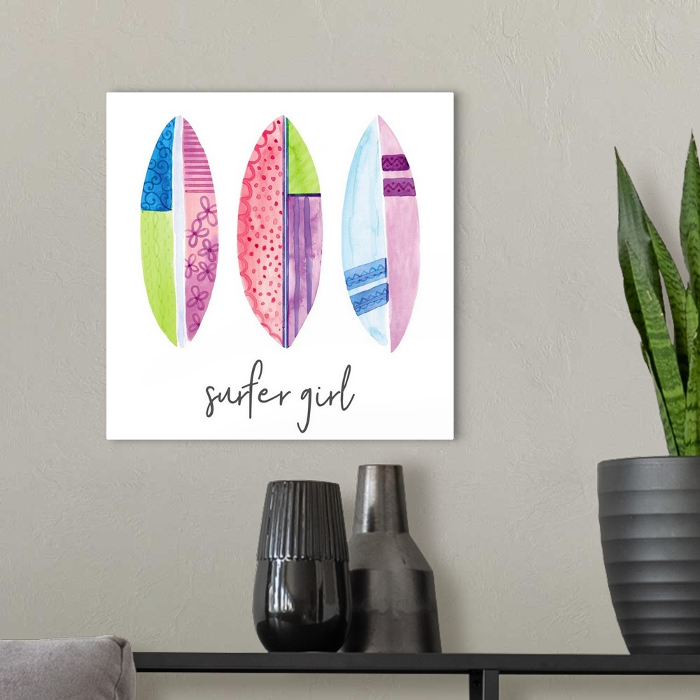 A modern room featuring A watercolor image of a group of colorful patterned surfboards and the text 'surfer girl.'