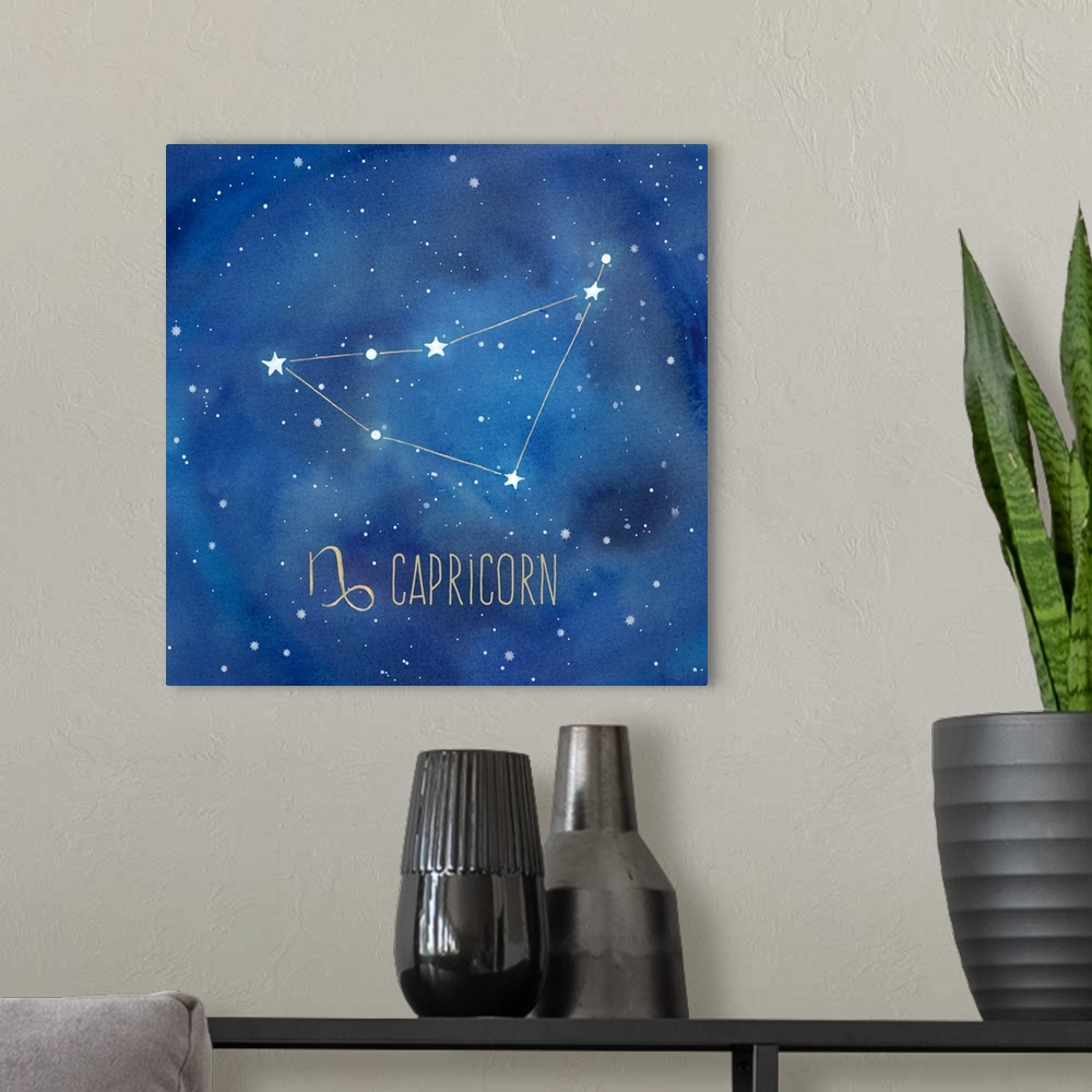 A modern room featuring Square artwork of the constellation of Capricorn with the symbol.