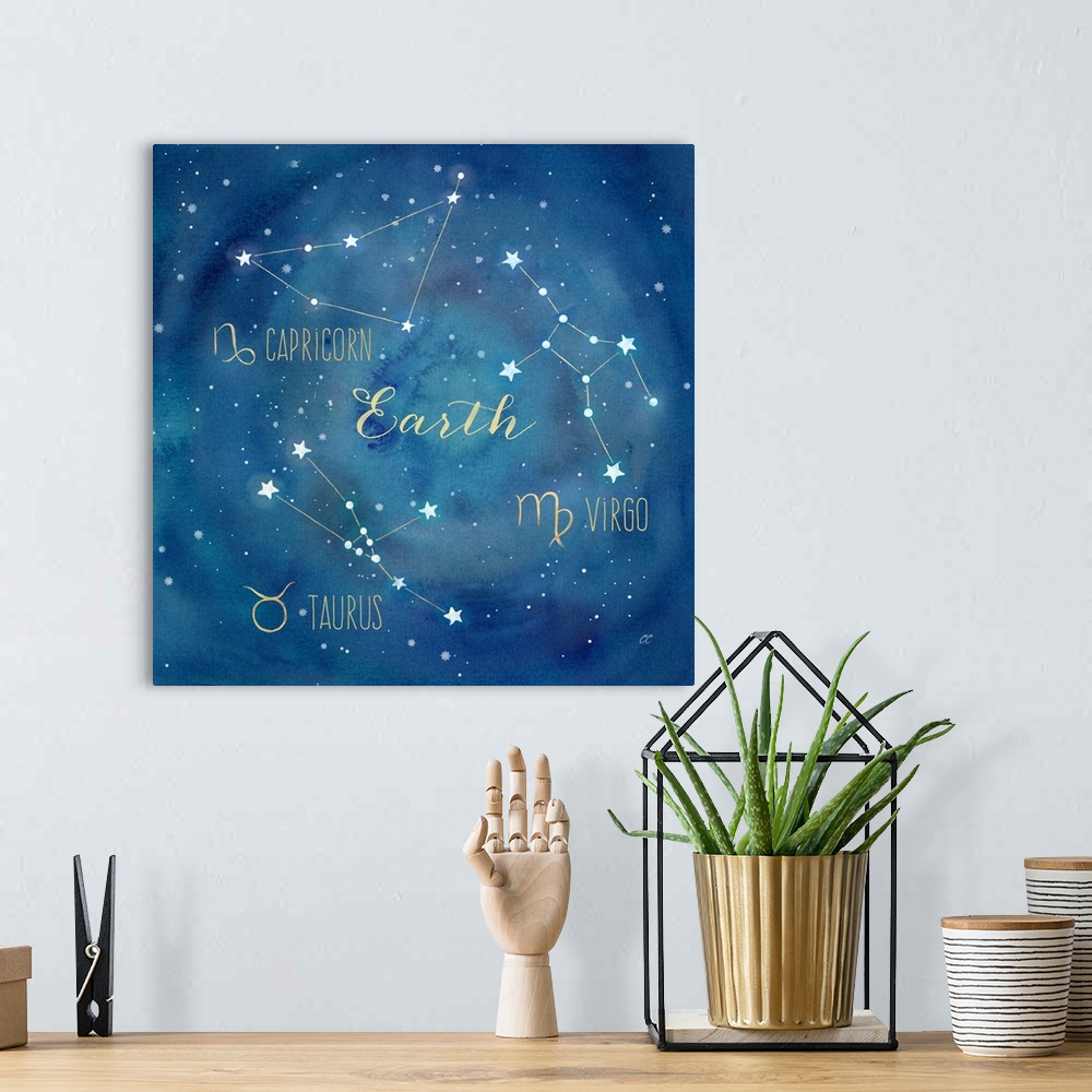 A bohemian room featuring Square artwork of the constellations of Capricorn, Taurus and Virgo with the symbols.