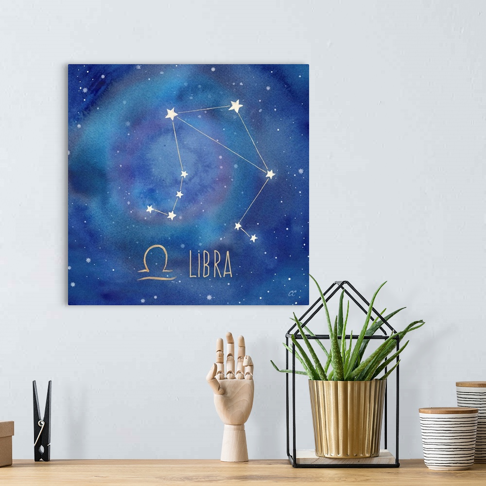A bohemian room featuring Square artwork of the constellation of Libra with the symbol.