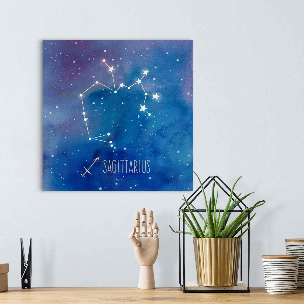 A bohemian room featuring Square artwork of the constellation of Sagittarious with the symbol.