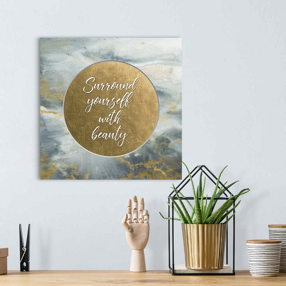 A bohemian room featuring "Surround yourself with beauty" on a metallic gold circle on a marbled gray and gold background.