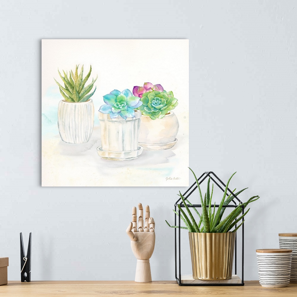 A bohemian room featuring A square decorative watercolor painting of succulents in clay pots.