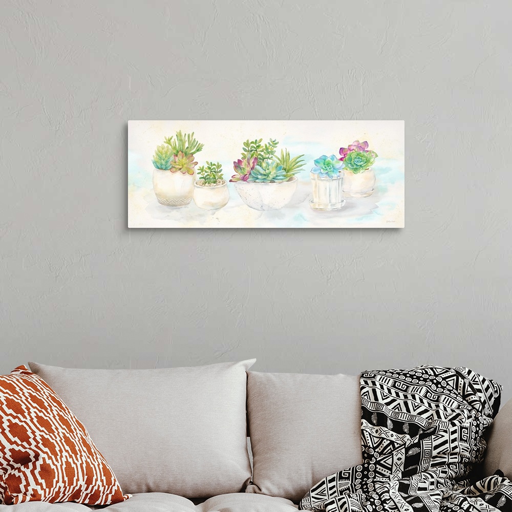 A bohemian room featuring A horizontal decorative watercolor painting of succulents in clay pots.