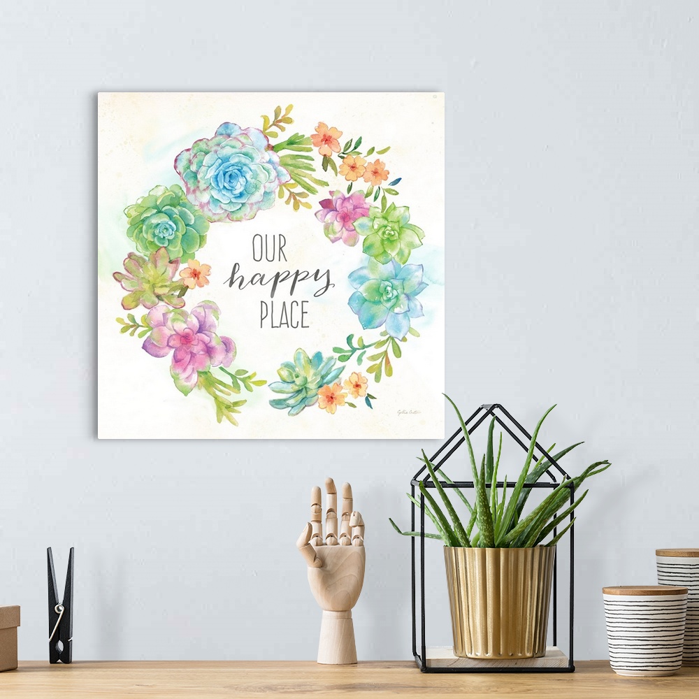 A bohemian room featuring "Our Happy Place" on a square decorative watercolor painting of a wreath of colorful succulents.