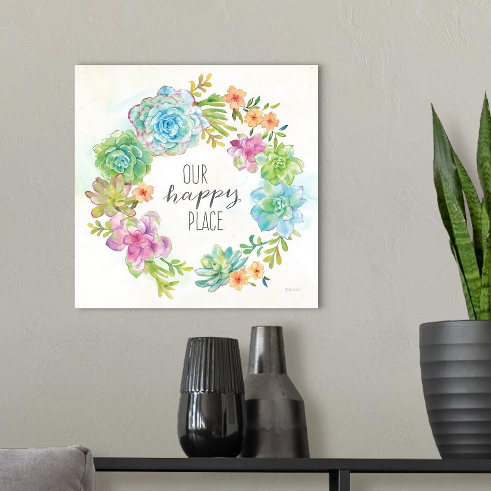 A modern room featuring "Our Happy Place" on a square decorative watercolor painting of a wreath of colorful succulents.