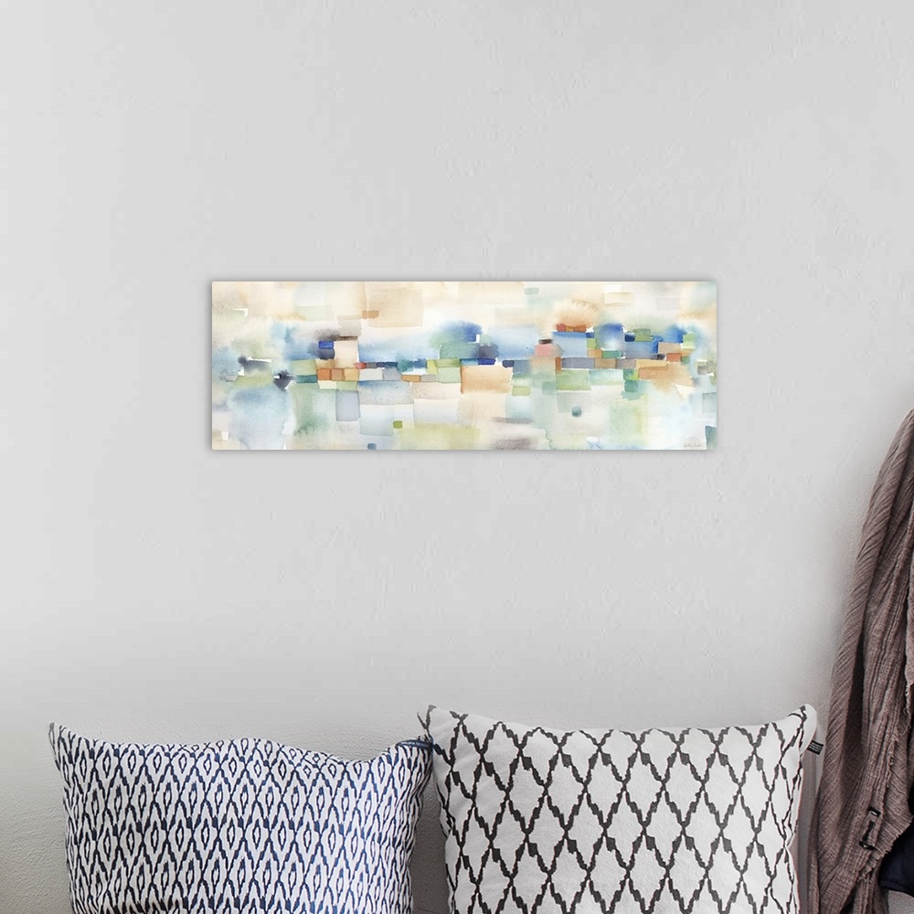 A bohemian room featuring Horizontal abstract watercolor painting in blurred square shapes in muted tones of brown, blue an...