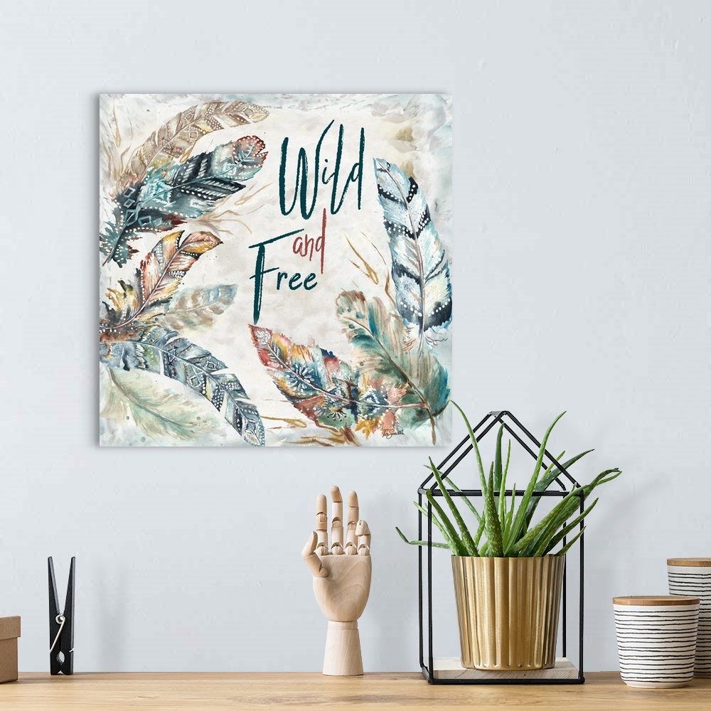 A bohemian room featuring A watercolor design of feathers with tribal patterns and the text "Wild and Free."