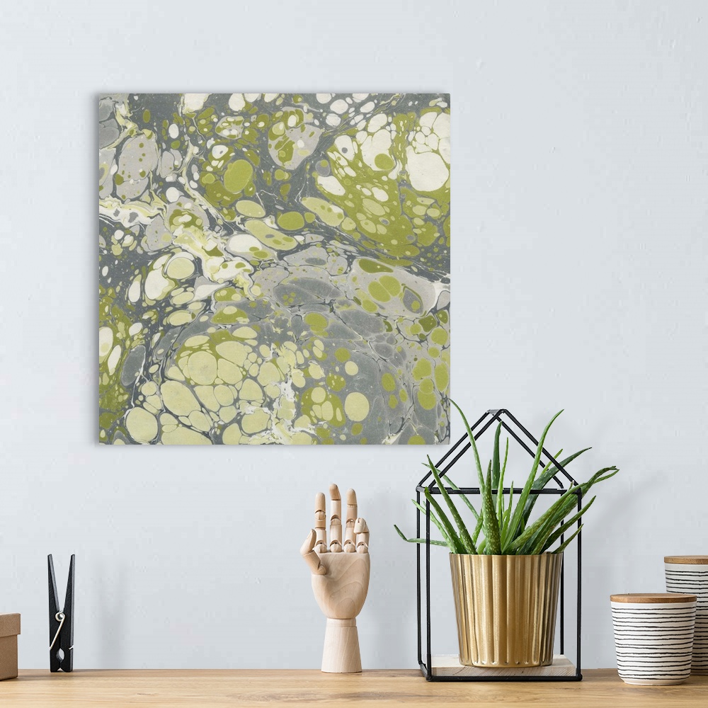A bohemian room featuring Square abstract artwork of swirls of green, gray and white shades in a marble effect.