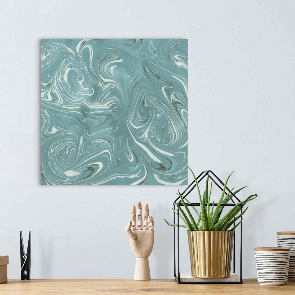 A bohemian room featuring Square abstract artwork of swirls of teal and white shades in a marble effect.