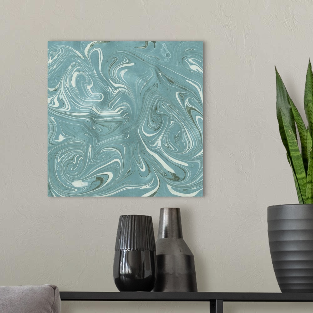 A modern room featuring Square abstract artwork of swirls of teal and white shades in a marble effect.