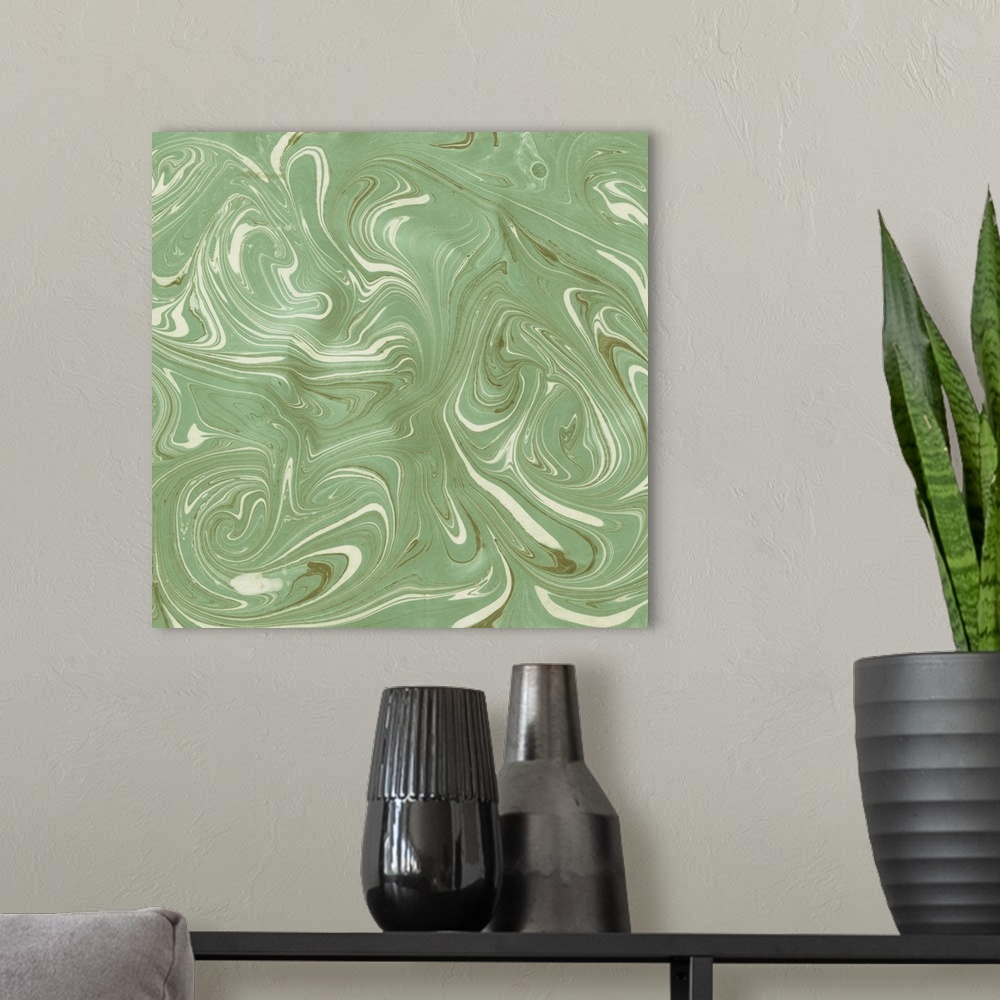 A modern room featuring Square abstract artwork of swirls of green and white shades in a marble effect.