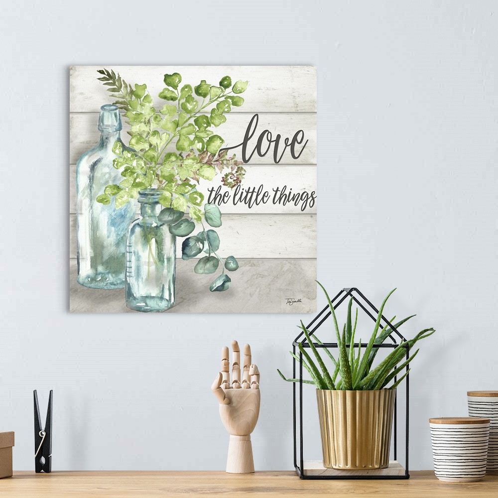 A bohemian room featuring "Love The Little Things" with glass bottles and greenery on a gray wood panel background.