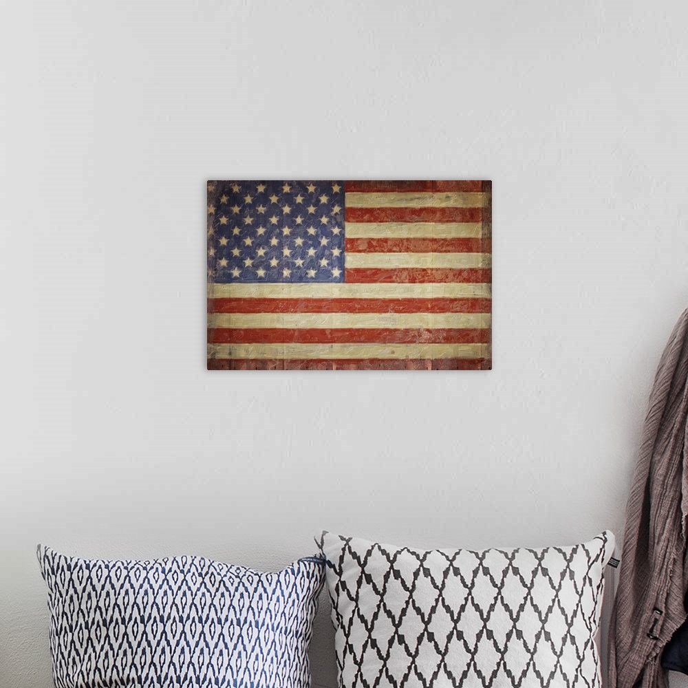 A bohemian room featuring The American flag with a distress appearance on wood planks.