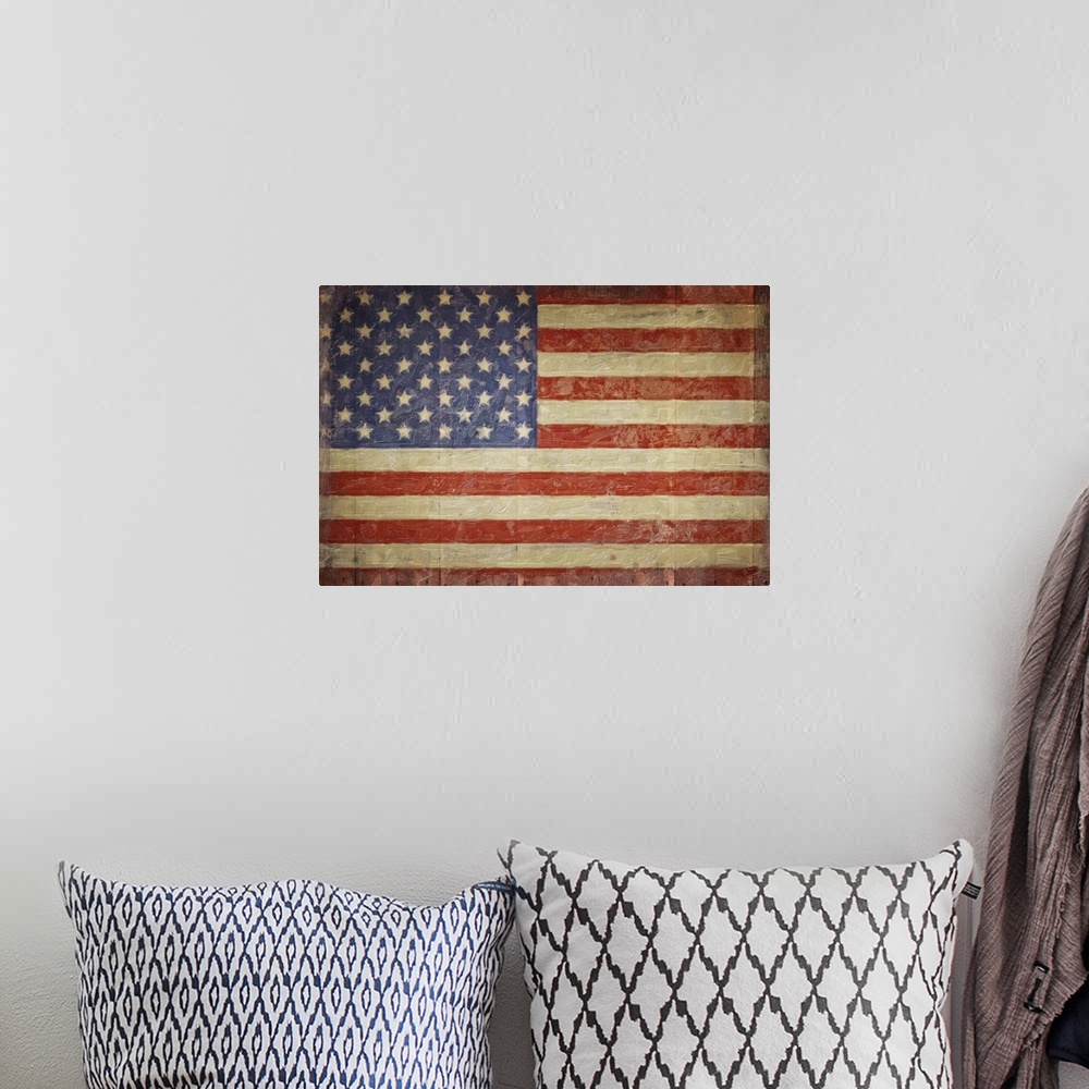 A bohemian room featuring The American flag with a distress appearance on wood planks.