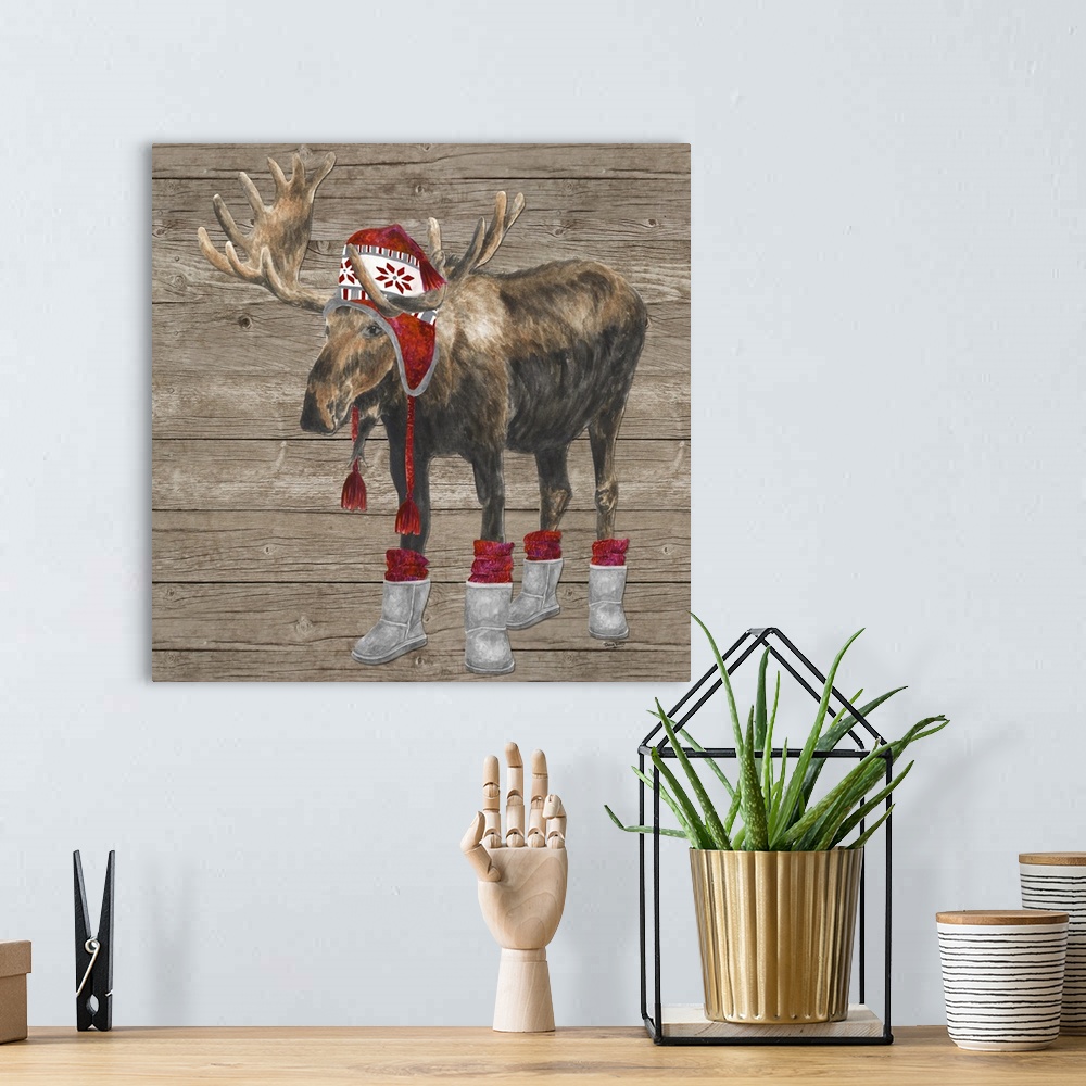 A bohemian room featuring Decorative image of a buck wearing a red cap and boots with red socks against a wood panel backdrop.