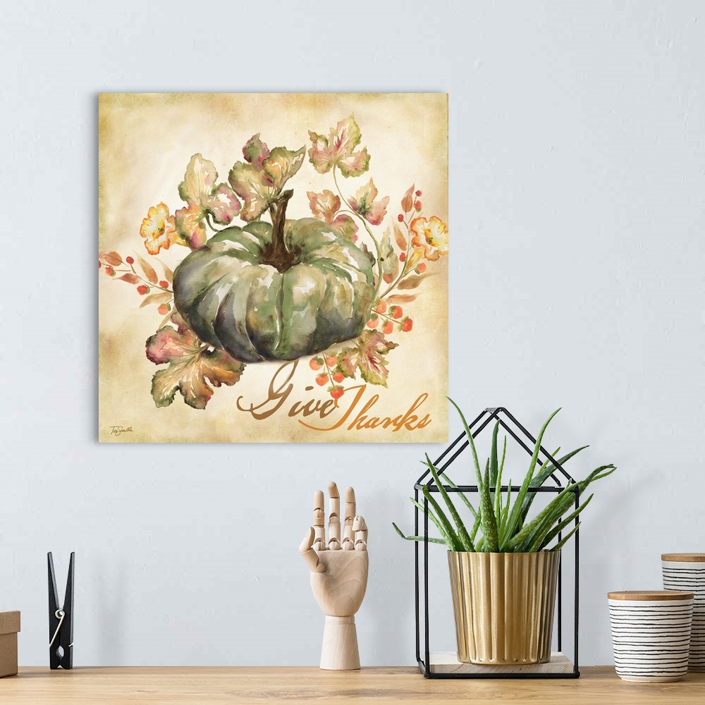 A bohemian room featuring Watercolor seasonal design of a blue pumpkin and leaves with the text "Give Thanks".