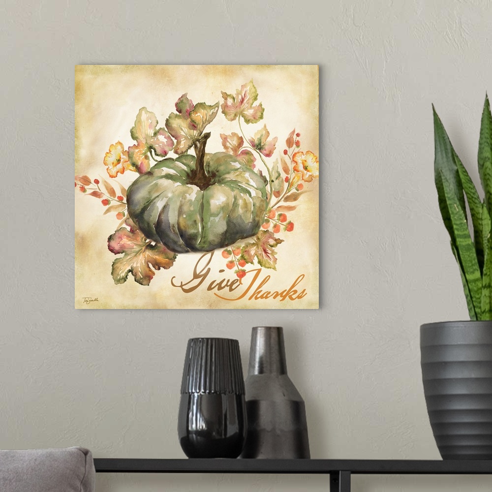 A modern room featuring Watercolor seasonal design of a blue pumpkin and leaves with the text "Give Thanks".