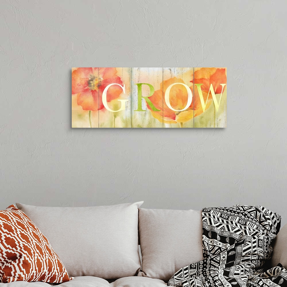 A bohemian room featuring "Grow" in white and green over a watercolor image of orange and red flowers with a wood plank app...