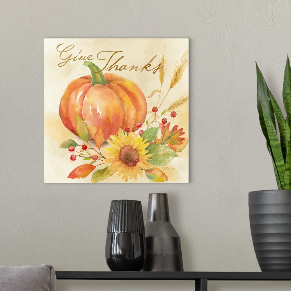 A modern room featuring "Give Thanks" with a pumpkin and autumn flowers in warm shades.
