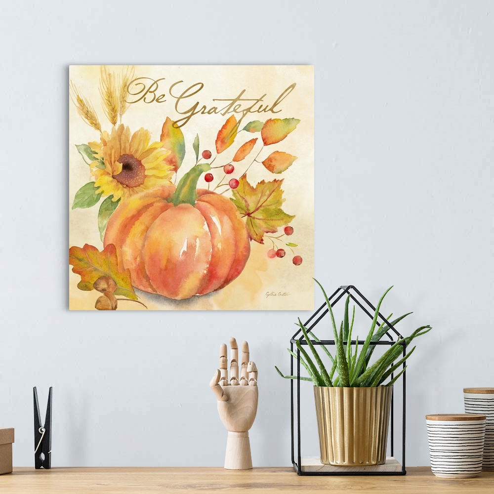 A bohemian room featuring "Be Grateful" with a pumpkin and autumn leaves in warm shades.