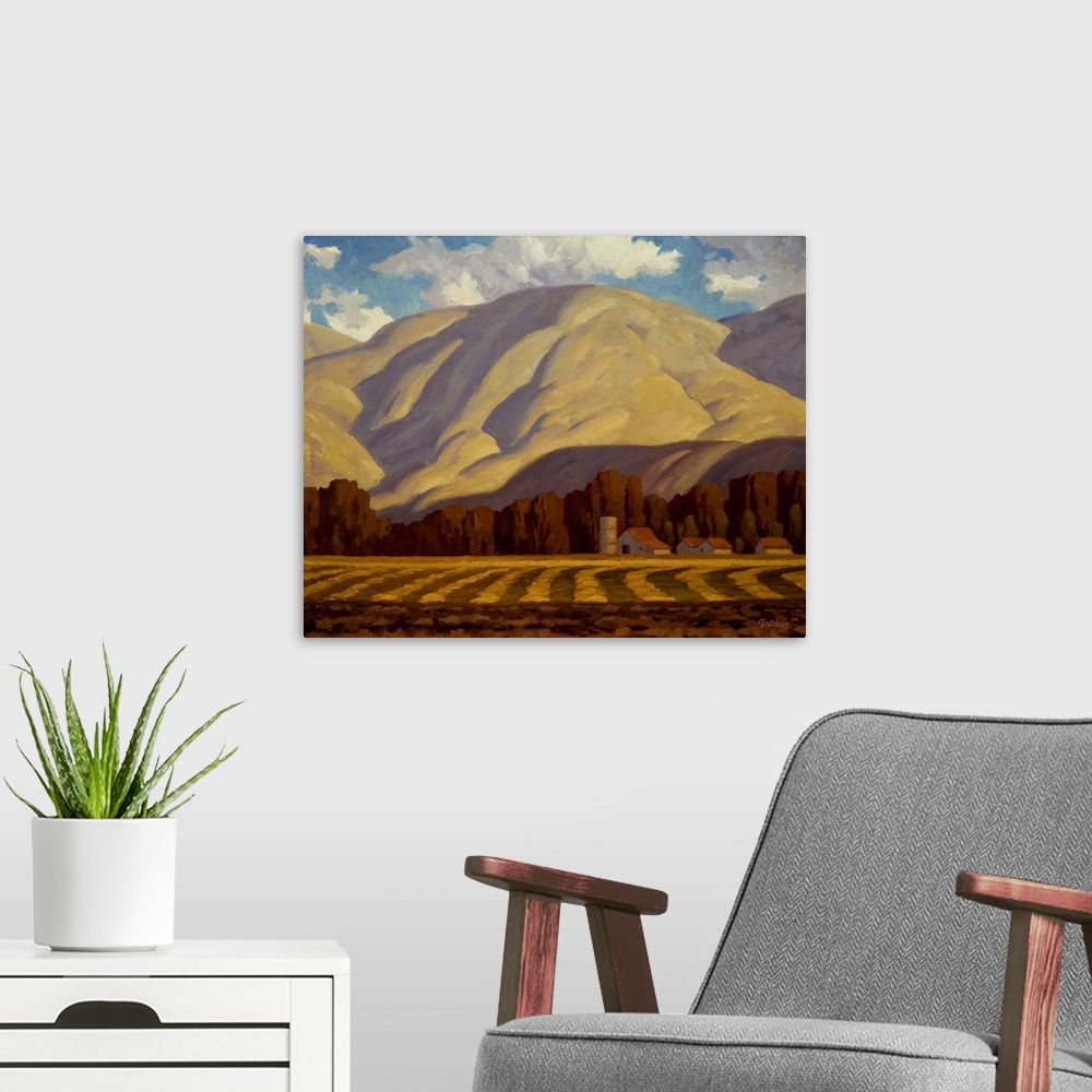 A modern room featuring Landscape painting of Chandler Farm with a mountain.