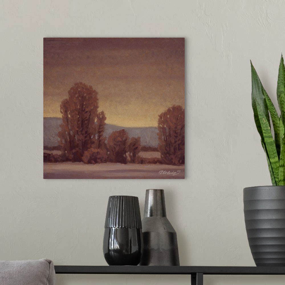 A modern room featuring Landscape painting of trees in a tonalist winter setting.