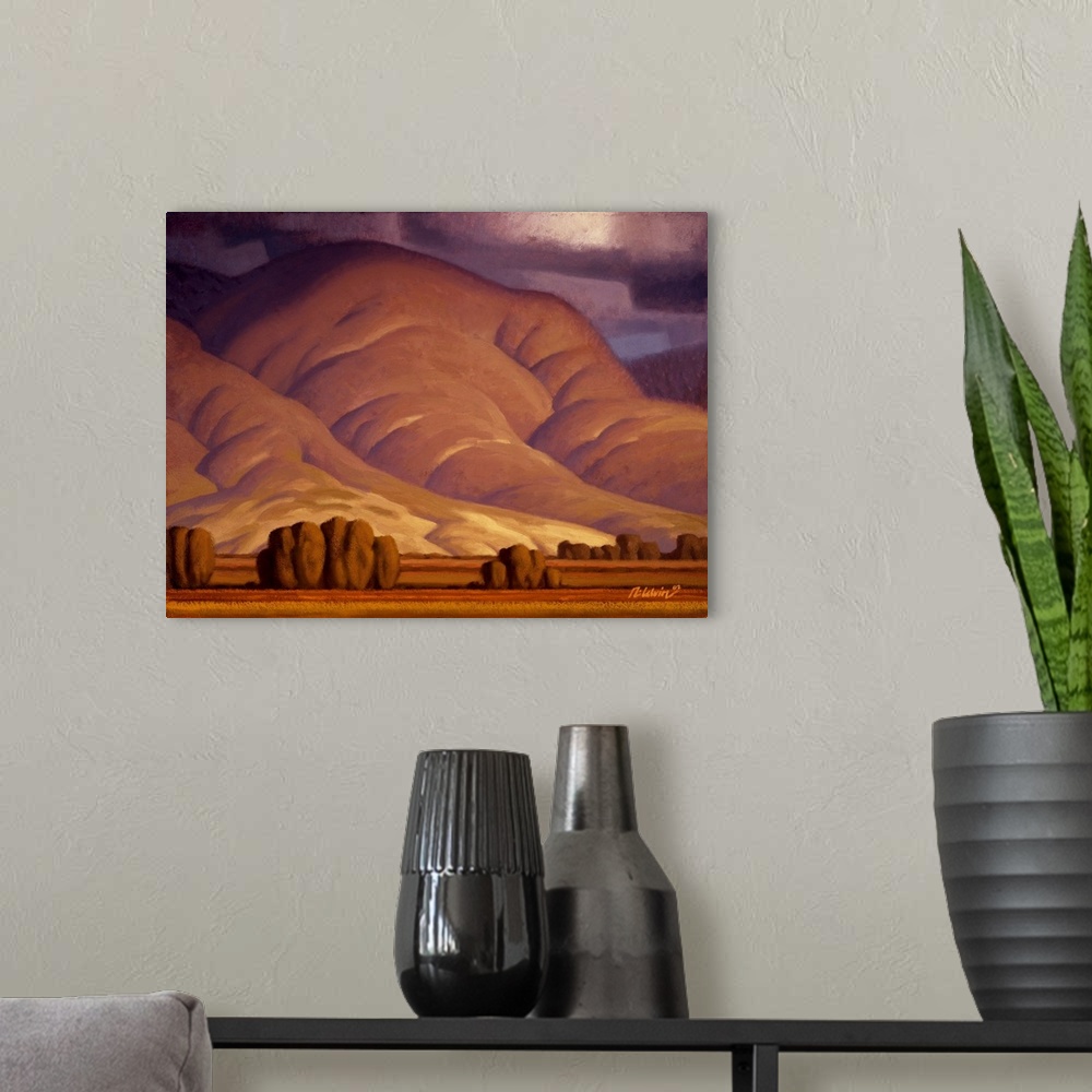 A modern room featuring Landscape painting of rolling Autumn hills with threatening snow clouds.