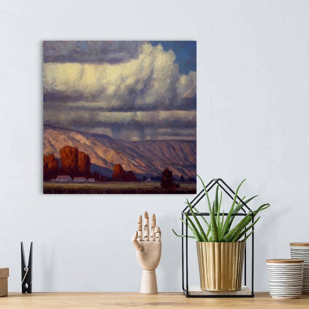 A bohemian room featuring Landscape painting of a mountain valley with the rain clouds of September.