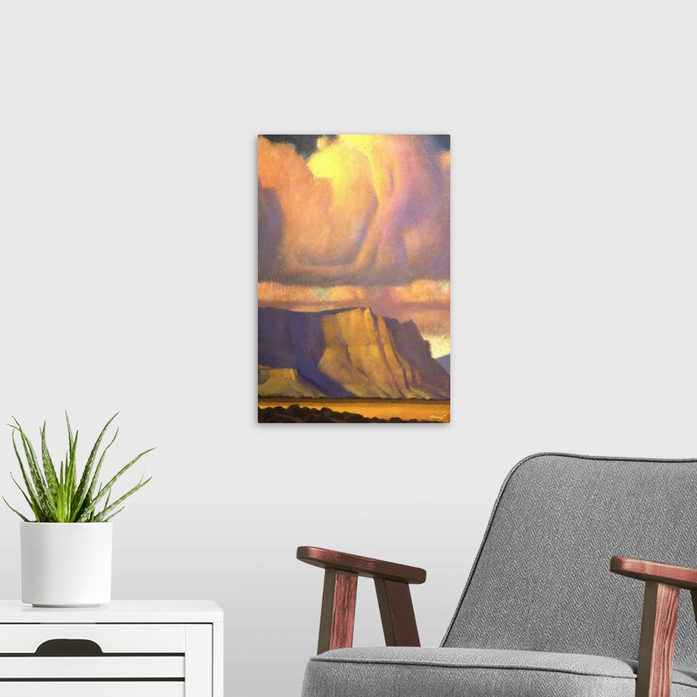 A modern room featuring Landscape painting of the Vermilion Cliffs of Northern Arizona with sunset colored clouds.