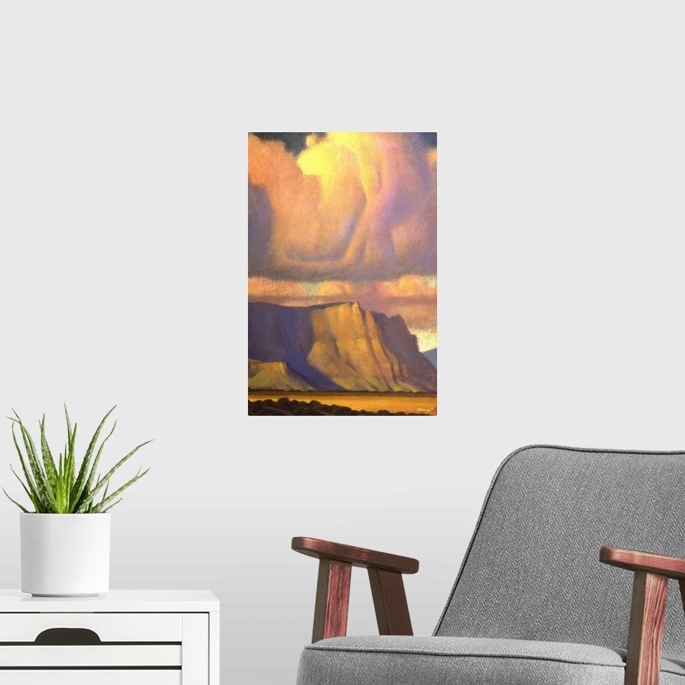 A modern room featuring Landscape painting of the Vermilion Cliffs of Northern Arizona with sunset colored clouds.