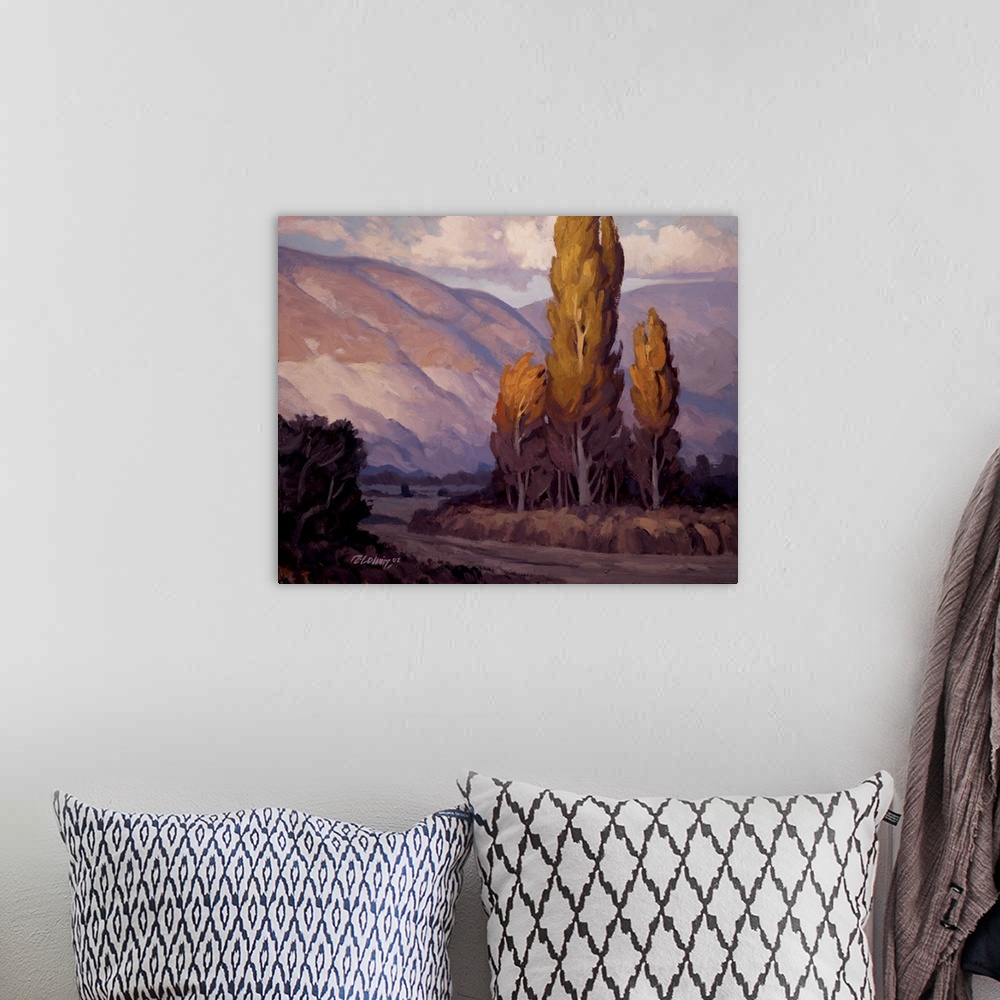 A bohemian room featuring Purple toned landscape painting of evening light on the Wasatch Mountains.