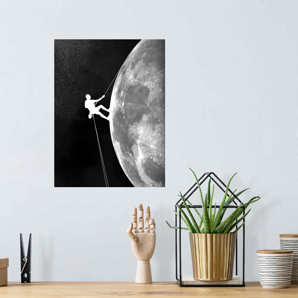 A bohemian room featuring Contemporary artwork in black and white of a climber shown descending down the side of the moon.