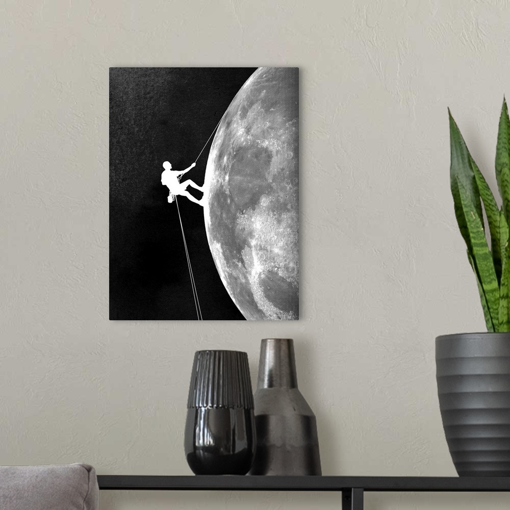 A modern room featuring Contemporary artwork in black and white of a climber shown descending down the side of the moon.