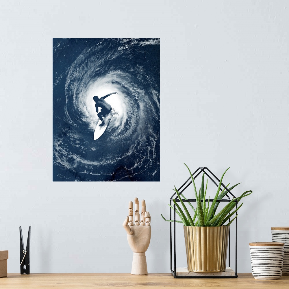 A bohemian room featuring Big photo on canvas of a surfer on top of an image of a hurricane in the ocean.