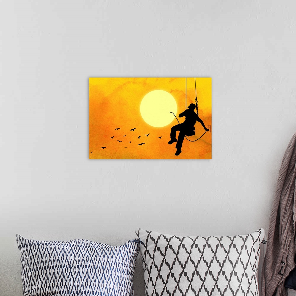 A bohemian room featuring This conceptual, horizontal contemporary artwork shows a silhouetted workman hanging on a swing p...