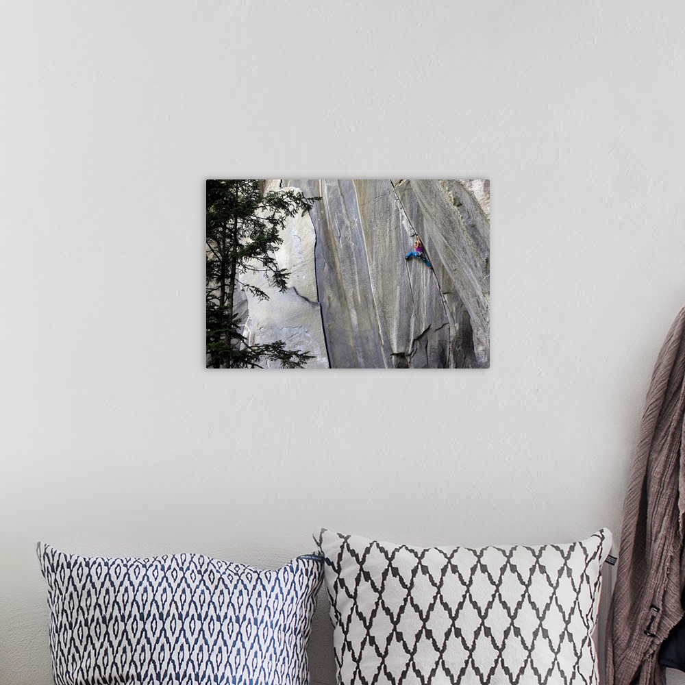 A bohemian room featuring A climber ascending a difficult crack climb, Cadarese Valley, northern Italy, Europe
